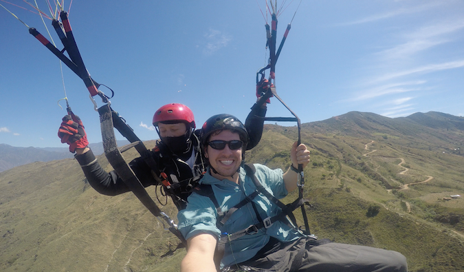 Backpacker doing adventure sports abroad
