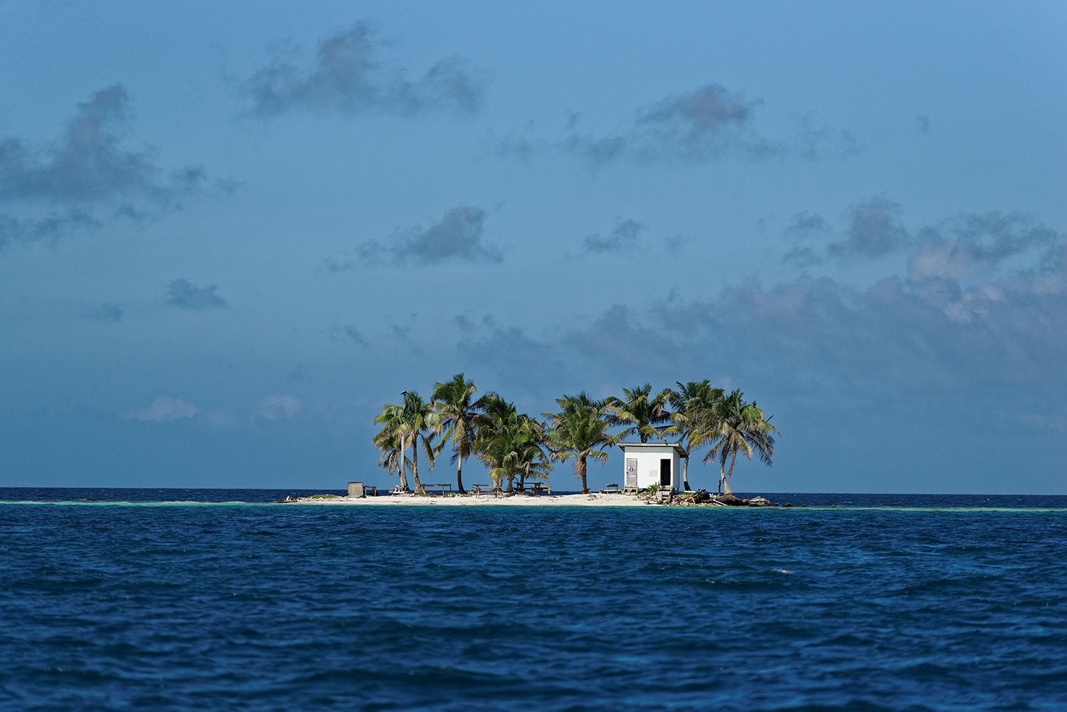 "Toilet island" in the middle of the Caribbean sea off the coast of Placencia, Belize