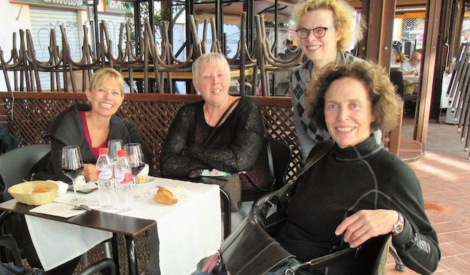 Older female travelers meet up overseas