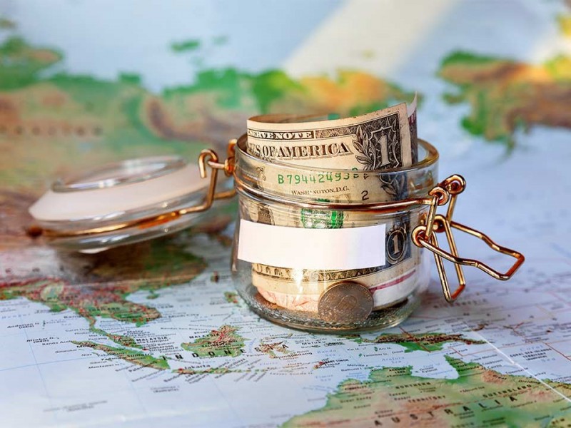 small-money-jar-on-world-map-800x600.jpg