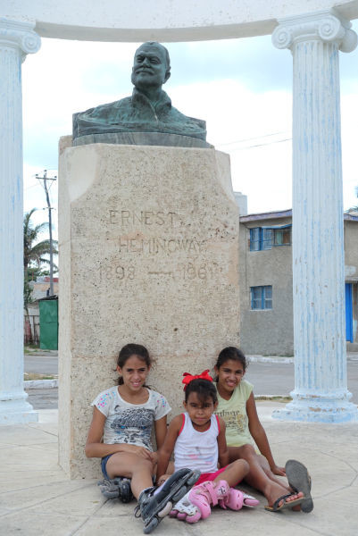 These kids were all smiles as our big group of American tourists approached the Hemingway bust.