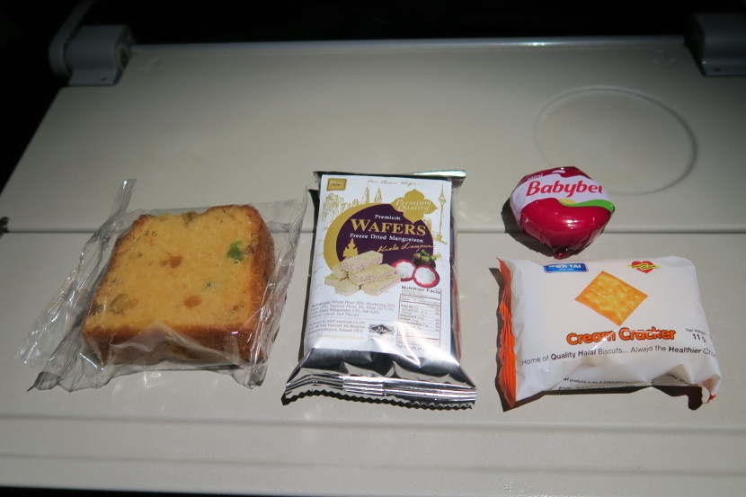 Instead of a self-serve snack area in the galley, each passenger received a box of snacks in the middle of the flight.