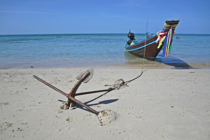 A boat moored along the beach in Koh Phangan.