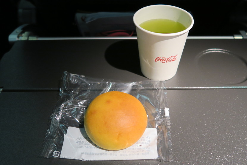 The mid-flight snack consisted of a choice of juice or tea and a meat bun.