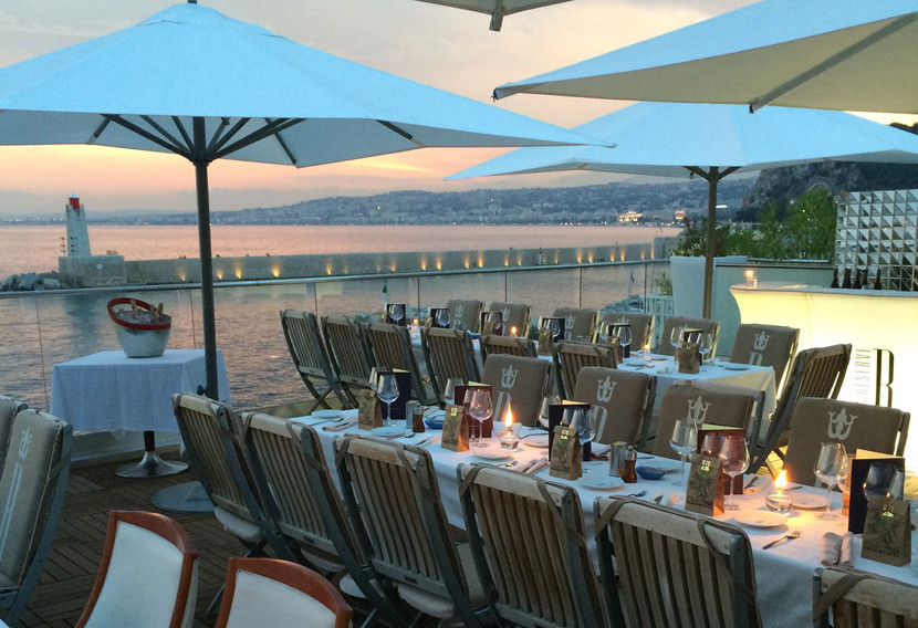 Catch the sunset from a seaside restaurant like La Réserve in Nice. Image courtesy of La Réserve's Facebook page.