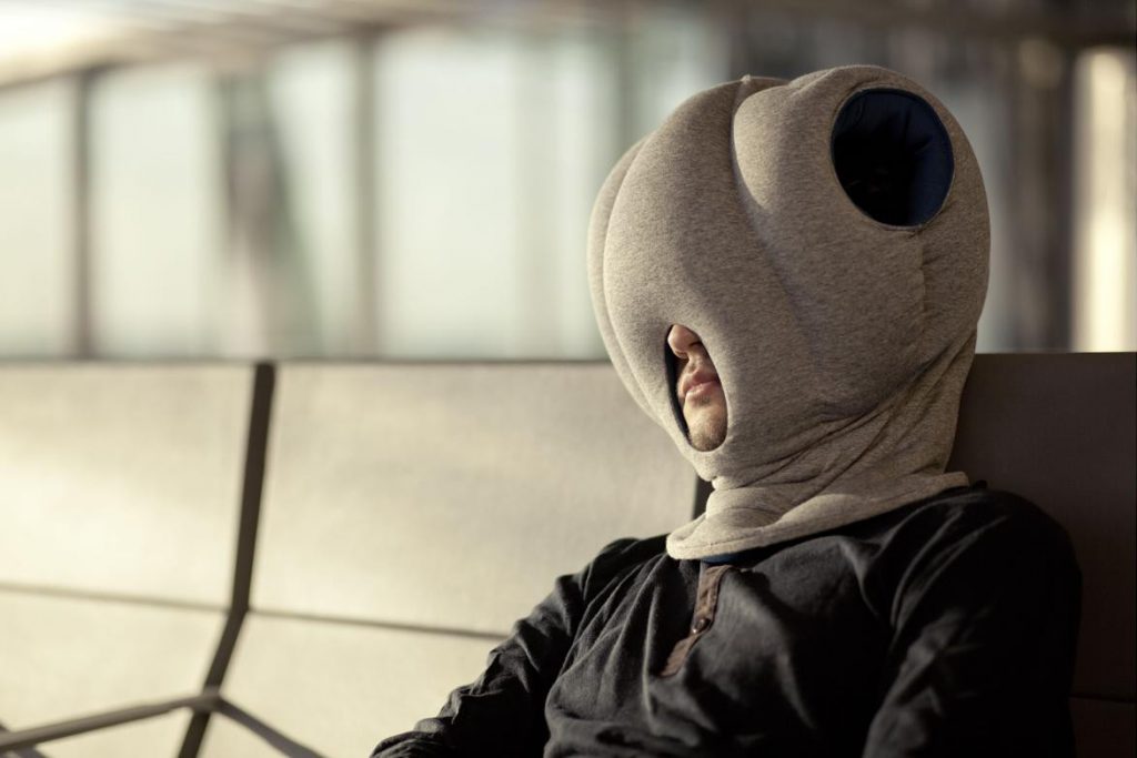 The Ostrich Pillow is a bit of a sight in public, but anything for a good night's sleep. Pic: Res Features/Digital Spy UK