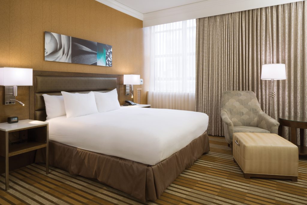 Rooms come in warm colors, and are equipped with modern amenities