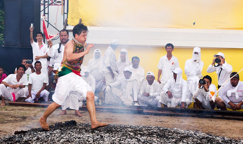 A devotee runs across hot coal during the festival. Pic:Phuket@photographer.net/flickr