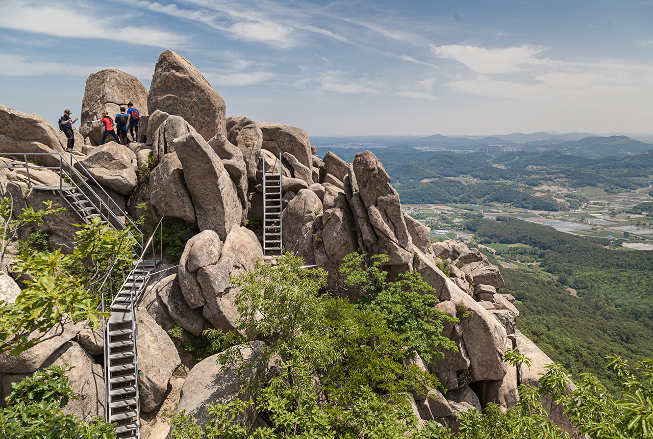 ‘Snakes and Ladders’. Rickety staircases are the only way to reach the top of many of South Korea’s granite-topped peaks – Mount Palbong, Seosan