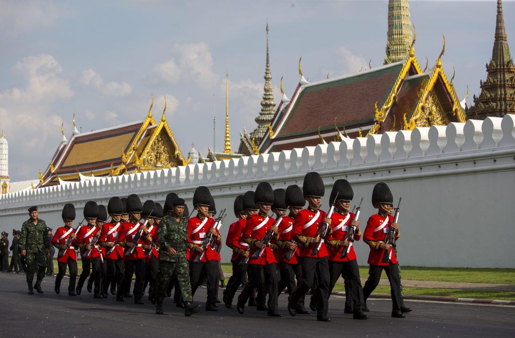 The Thai Royal Guard march outside The Grand Palace prior to a religious ceremony. Pic: AP