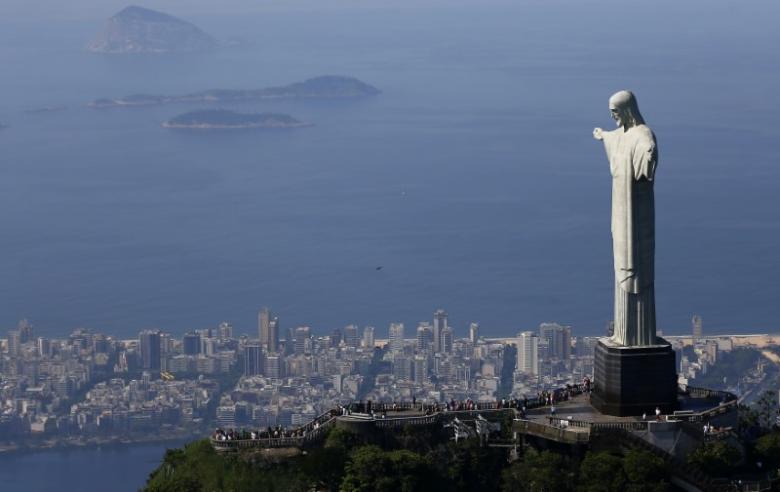 Tourists visit the Christ the Redeemer statue in Rio de Janeiro